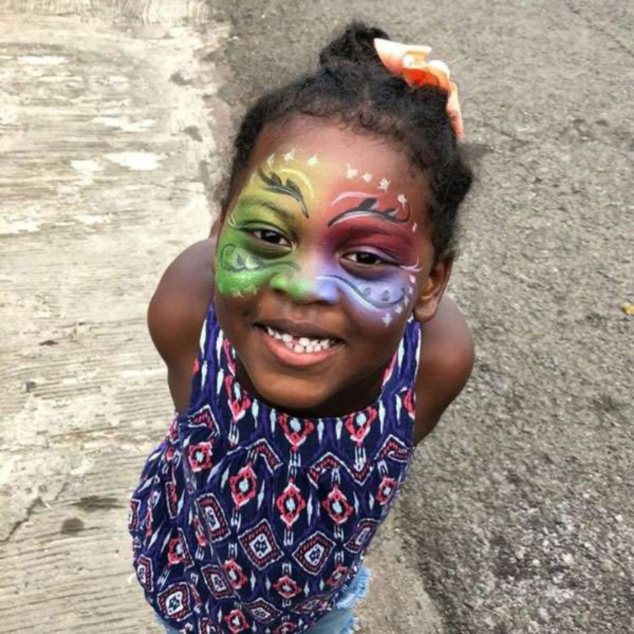 Girl with a colourful face painting